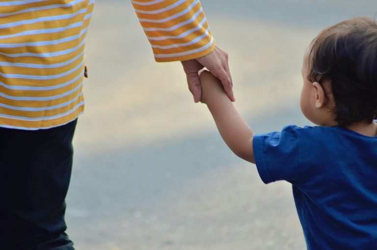 holding hands aspiring foster carer of autistic child